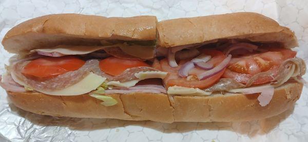 American Hero: Ham, genoa salami, provolone, lettuce, tomato, onion, oil, vinegar