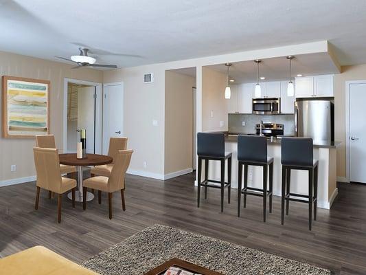 Spacious Living Areas and Updated Kitchens with Quartz Stone Countertops, Tile Backsplashes, and Stainless Steel Appliances