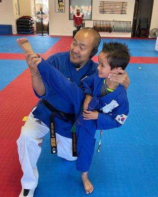 Kai with Master Lee: Kai just graduated from green belt to blue belt.