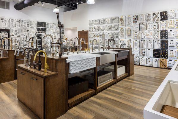 Kitchen sink/faucet area with walls of hardware on display