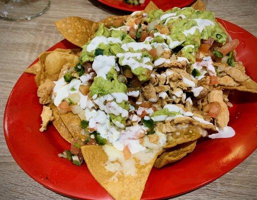 Loaded Nachos with Chicken and guacamole!