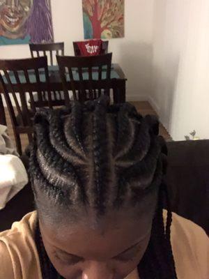 Top of half cornrows, half individuals (also called Fulani braids)