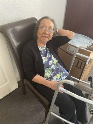 My mom in her room sitting on the chair.  Toni took this pic on my mom's 1st morning there.