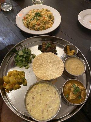 Spicy noodles with cheese (back) and Thali platter