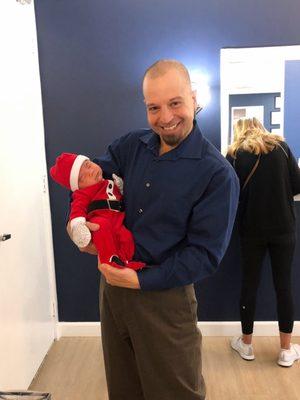 Dr. Ben-Yehuda is holding my little baby Santa