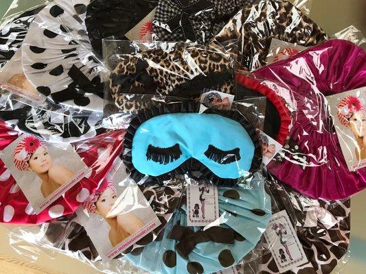 Assortment of Mimi A La Mode sleep masks and shower caps.