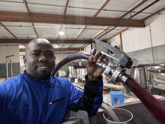 Doing a pump over of Cabernet Sauvignon during 2019 harvest