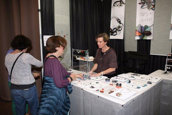 Artist Lou Ann Townsend chats with a customer