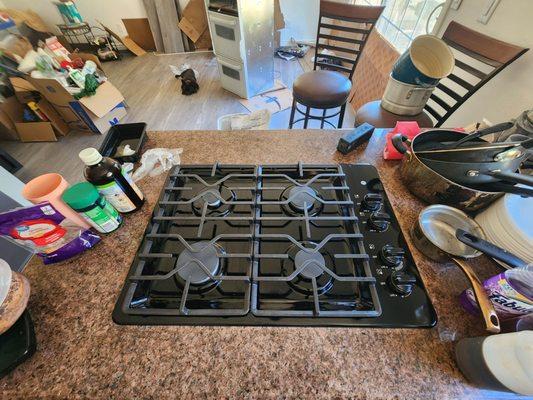 (Pardon our Prepping to move mess), freshly installed GE cooktop...