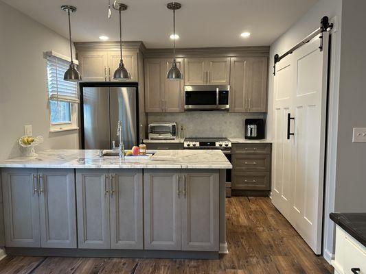 Kitchen Renovation to include Fabuwood Cabinetry, Quartzite Counters, Vinyl Luxury Flooring and a Bi-Fold Barn Door