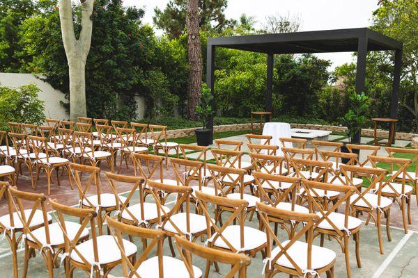 wedding with cross back wooden chairs