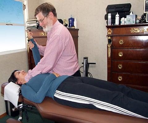 Muscle testing, also known as applied kinesiology.