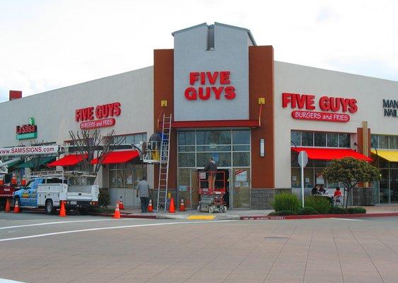 Three sets of individual channel letter signs for Five Guys Burgers and Fries.