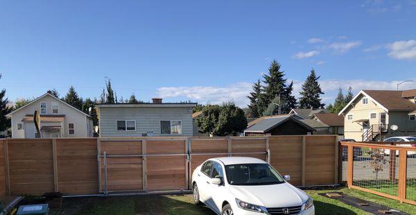 Custom gate and fence that rolls on tracks