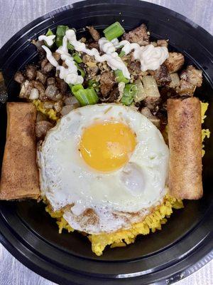 Pork Sisig Selog ( rice bowl ) Sizzling diced pork with fried egg, Java rice and 2 lumpias ( Shanghai )