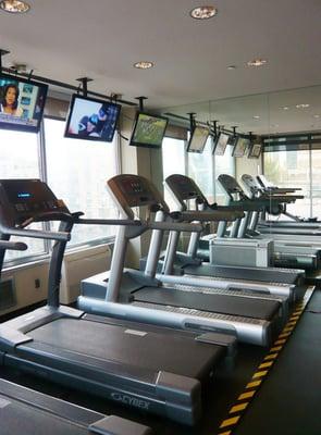 One of two roof-level gyms, with windows overlooking the East River