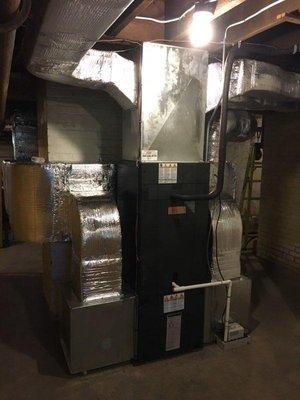 Gas furnace installation with associated duct work.