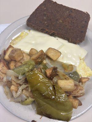 1 eggs scrapple and home fries with onion peppers