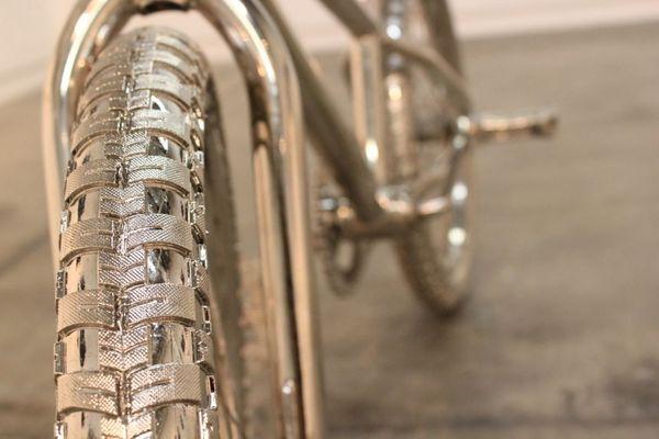 Detail of chrome bike by @jillelizabeth_gower for her art exhibit in an art gallery.