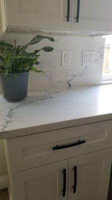 Quartz and matching back splash.