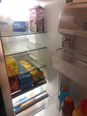 No food in the fridge, or food is included.