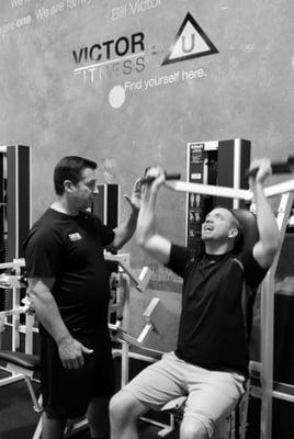 Bill Victor using the high-intensity training (HIT) method when working with a client.