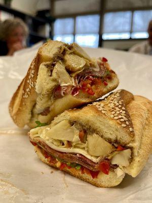 Stugots- April 24 monthly special - Gabagool , sharp provolone , vinegar peppers , artichokes relish, bomba chili on semolina