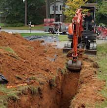 Excavation to install new sewer line and water line.