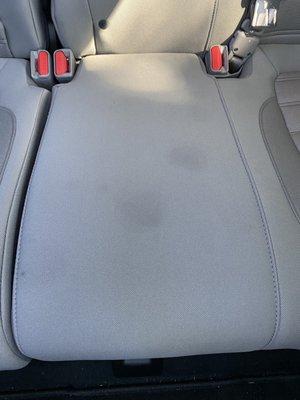 Two dirty spot on the rear middle seat