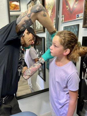 Eddie showing us how to clean the piercing.