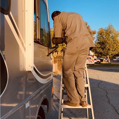 Service Tech fixing our mirror - they just happened to have the odd part needed in stock! Thank you Jesus!