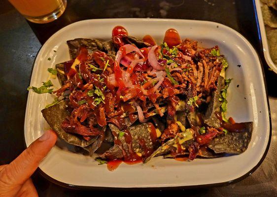 Brisket nachos. Love the blue corn chips and the Brisket? Elite level.