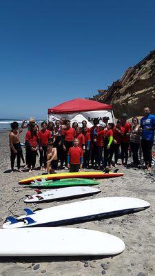 Group photo of the first week of surf camp at Moonlight Beach in Encinitas.  We have the main beach at Moonlight.