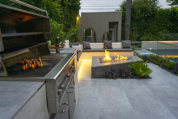 BBQ and custom fire place in outdoor living space.