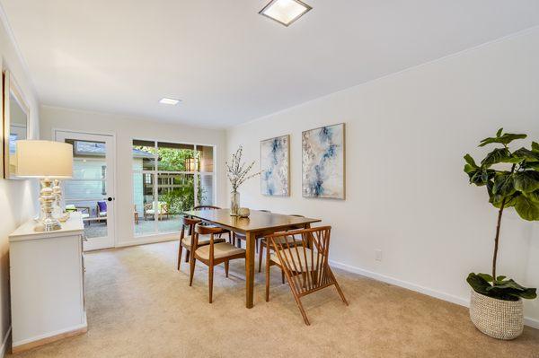 Dining room with clean carpeting.