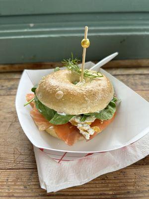 Salmon lox with egg and spinach on a bagel