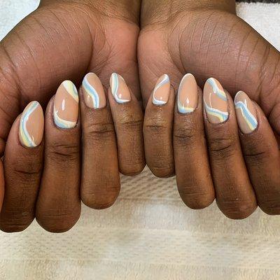 Gel polish and trendy nail art on natural nails