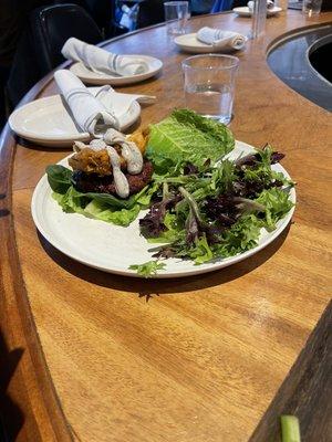 Truffle burger on lettuce wrap with side salad