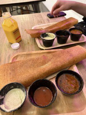 dosa with spicy potatoes, ghee, onions, gunpowder (comes with coconut chutney, sambar, red sweet & spicy chutney) + mango lassi