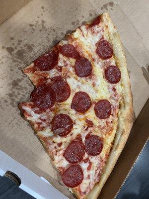 Pepperoni slice with some cheese