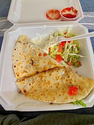 Steak Quesadilla w/ lettuce, tomorrow and sour cream.