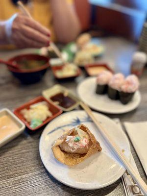 Put some crab salad, ginger, and wasabi inside my inari.