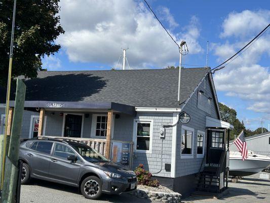 Exterior with outside bar area to the left and the main entrance to the restaurant