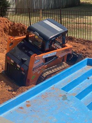 Bobcat stuck, damaged pool