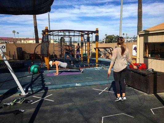 Women in the middle of a boxing workout.