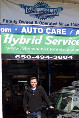 Kurt and the shops new hybrid sign. We have invested heavily in hybrid repair and training to meet our customers needs.