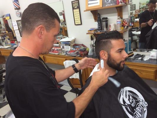 Getting a haircut with my friend Dave.