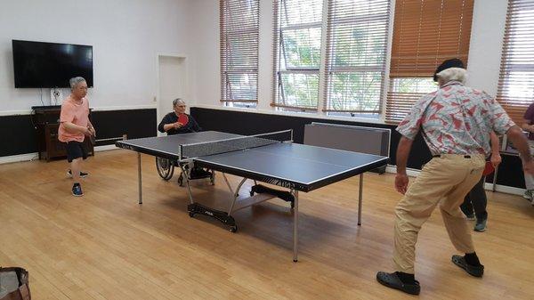 Seniors playing ping pong