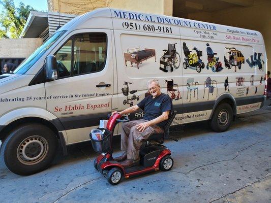 Ready for the summer in his newly delivered scooter!