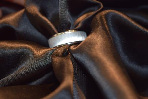 Men's wedding band in cobalt chrome with a cross satin polish.